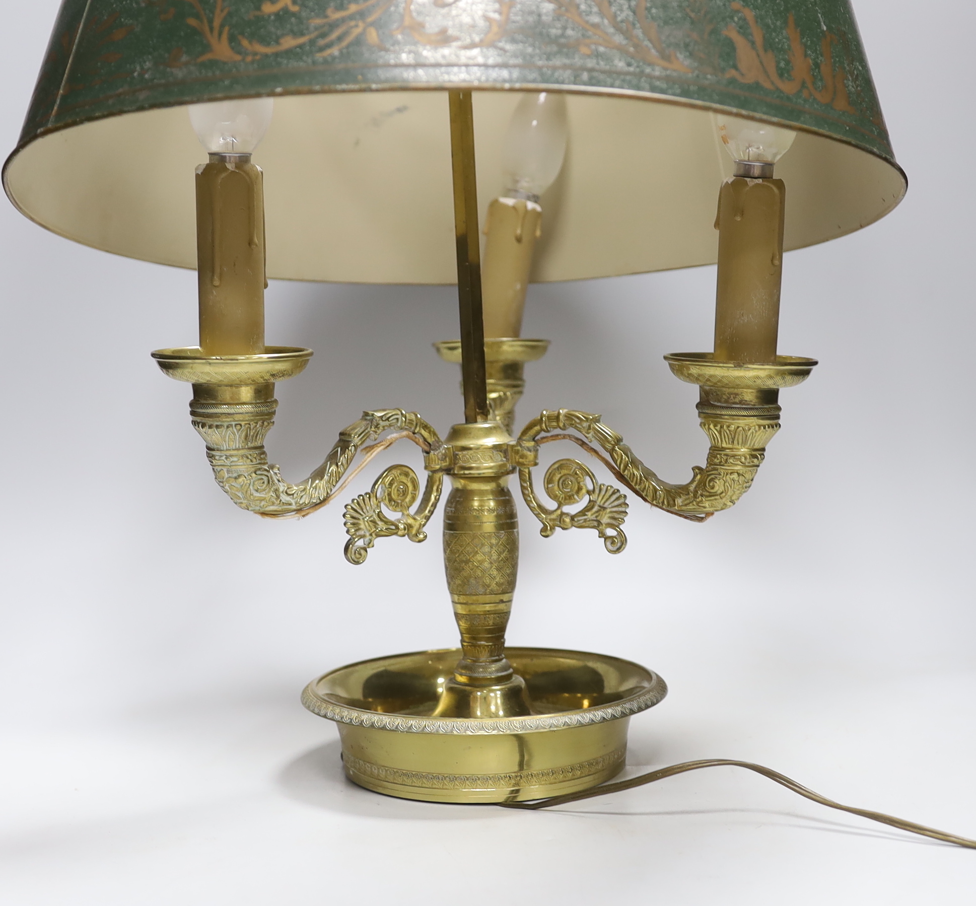 A Regency style gilt three branch/light table lamp with toleware shade, 65cm high